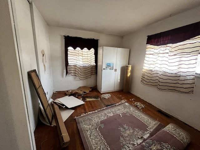 interior space with dark hardwood / wood-style flooring