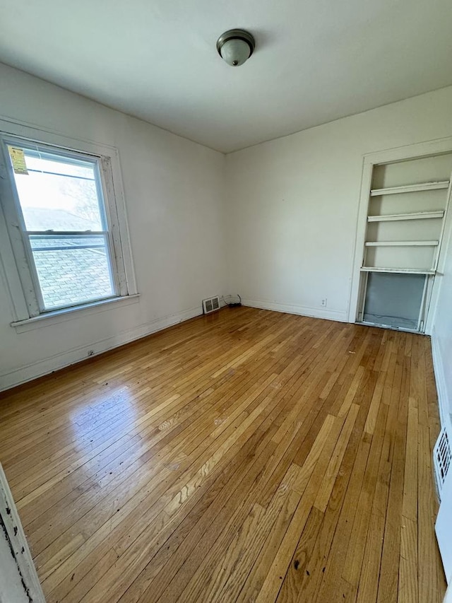 unfurnished bedroom with light hardwood / wood-style flooring