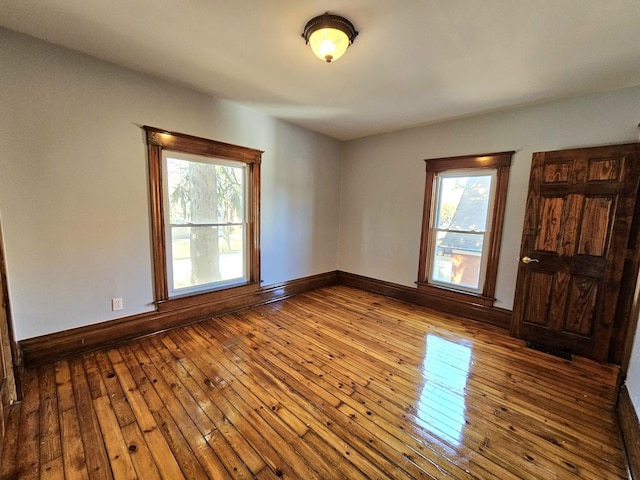 spare room featuring hardwood / wood-style flooring