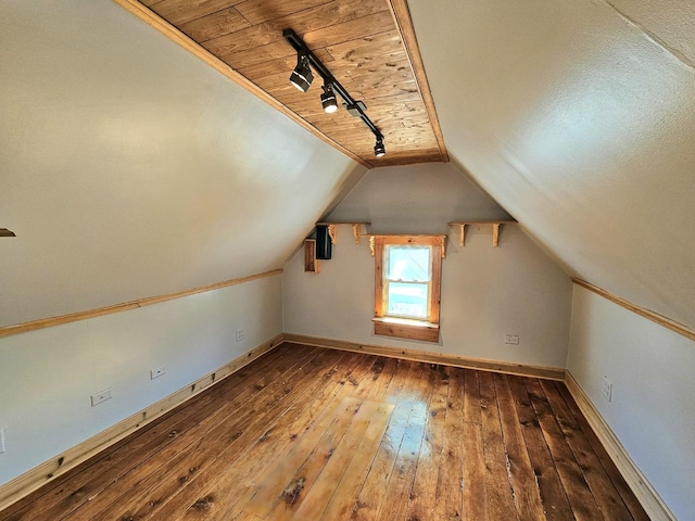 additional living space featuring lofted ceiling, hardwood / wood-style floors, and wooden ceiling