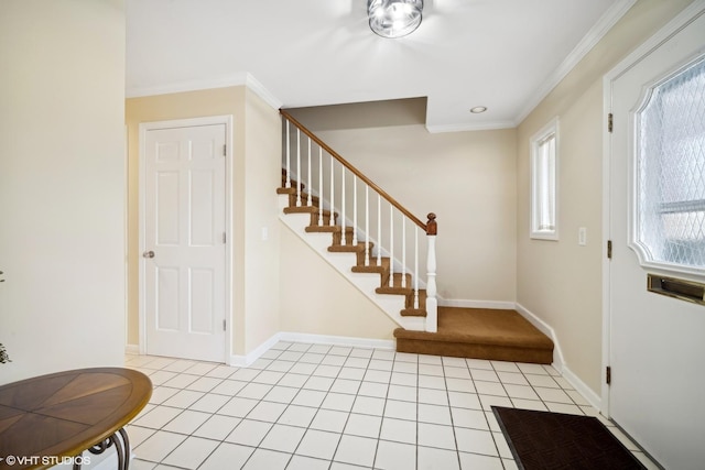 tiled foyer with crown molding