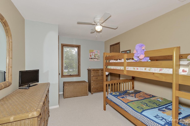 bedroom featuring ceiling fan and light carpet