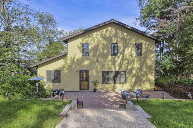 rear view of property with a patio area