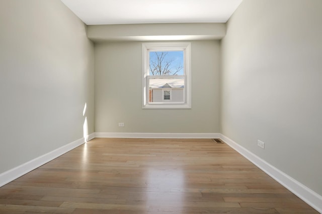 unfurnished room with light hardwood / wood-style floors