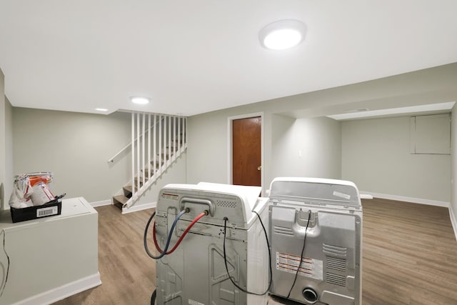 interior space featuring washer / clothes dryer and hardwood / wood-style flooring