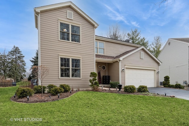 view of front property featuring a garage and a front lawn