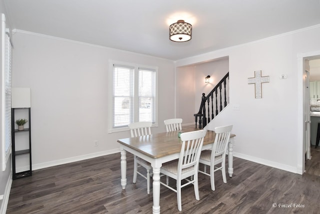 dining area with dark wood-type flooring and ornamental molding