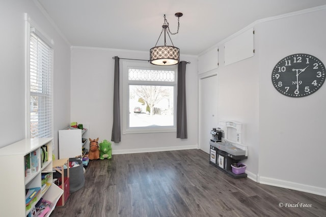 interior space with crown molding and dark hardwood / wood-style flooring