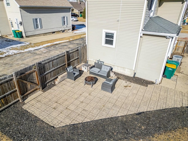 view of patio / terrace with an outdoor living space with a fire pit