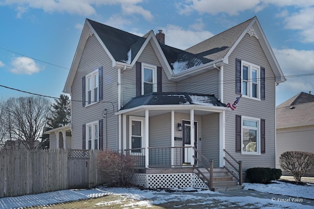 view of property featuring covered porch