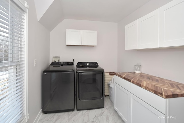 laundry room with cabinets and separate washer and dryer