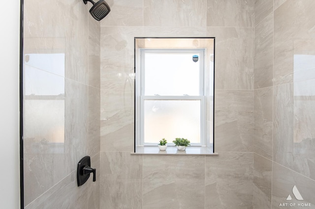 bathroom with tiled shower