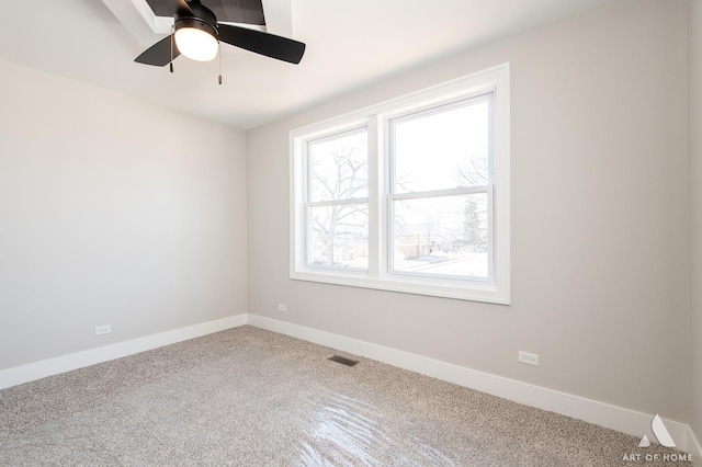 empty room with carpet floors and ceiling fan