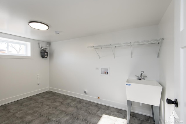 clothes washing area with hookup for a gas dryer and washer hookup