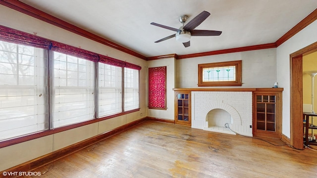 unfurnished living room with hardwood / wood-style flooring, crown molding, plenty of natural light, and ceiling fan