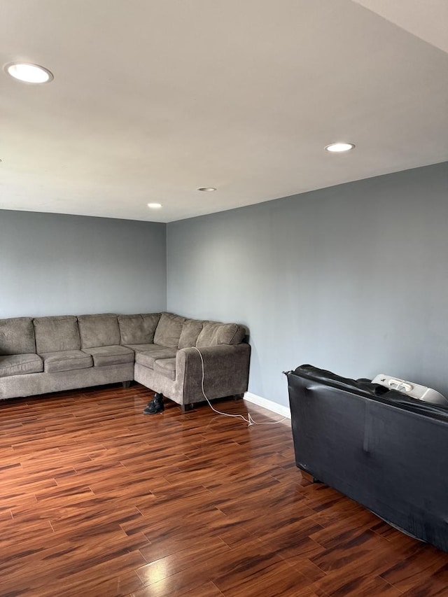 unfurnished living room with dark hardwood / wood-style floors