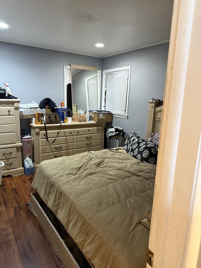 bedroom with dark wood-type flooring