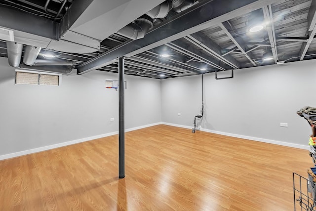 basement featuring wood-type flooring