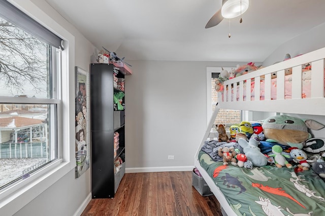 bedroom featuring dark wood-type flooring, ceiling fan, and lofted ceiling