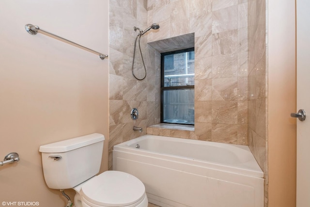 bathroom with toilet and bathing tub / shower combination