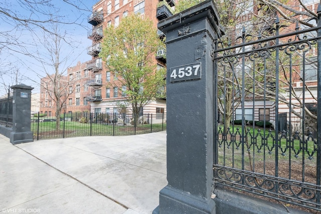 view of gate with fence