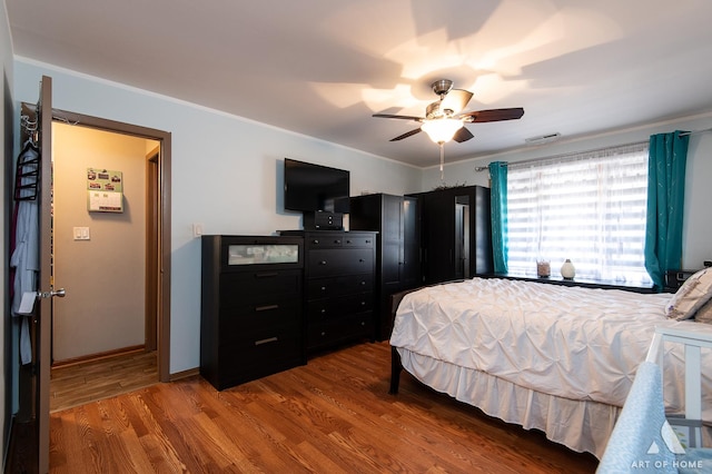 bedroom featuring hardwood / wood-style floors and ceiling fan