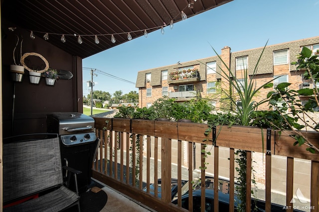 balcony featuring area for grilling