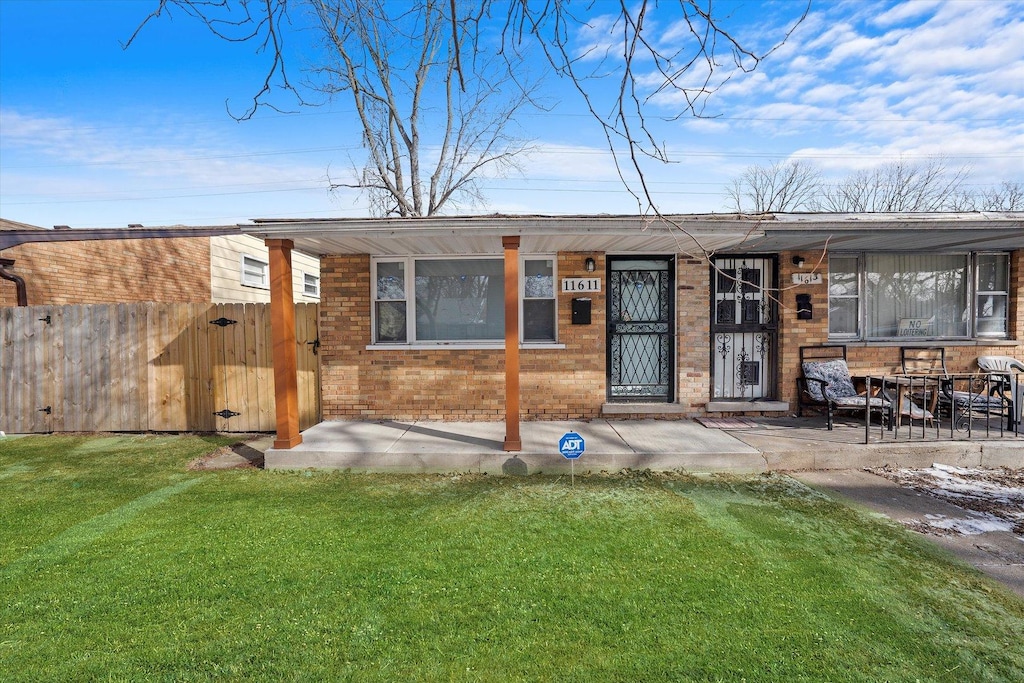 exterior space featuring a lawn and a patio