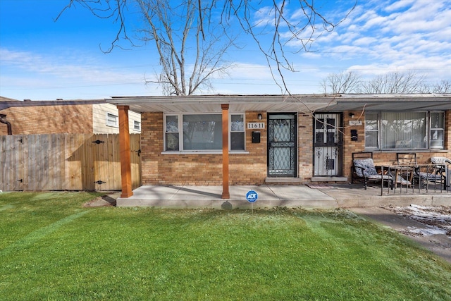 exterior space featuring a lawn and a patio