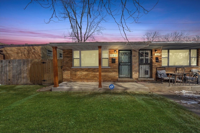 exterior space featuring a patio and a lawn