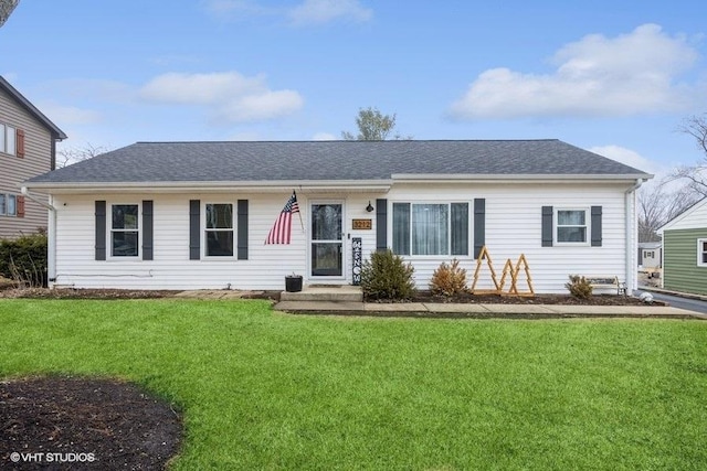 single story home featuring a front lawn