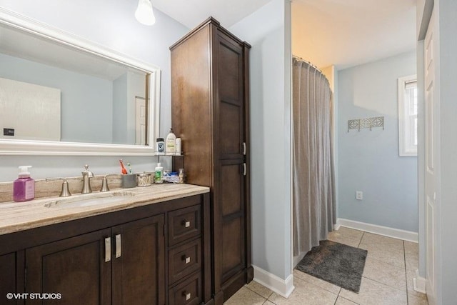 bathroom with vanity and tile patterned flooring