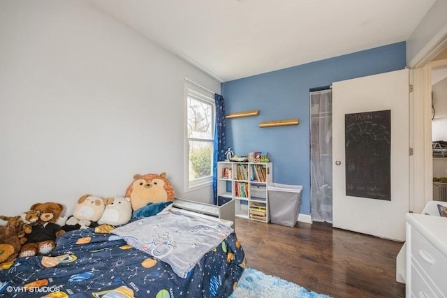 bedroom featuring dark hardwood / wood-style flooring