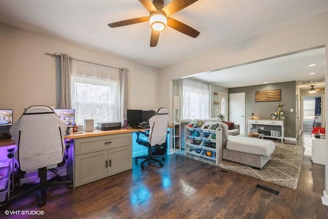 office featuring ceiling fan, dark hardwood / wood-style floors, and a healthy amount of sunlight