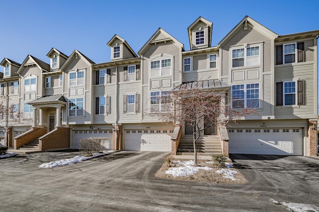 3460 Bradbury Cir, Aurora, IL 60504 - view of property featuring a garage, driveway, and a residential view