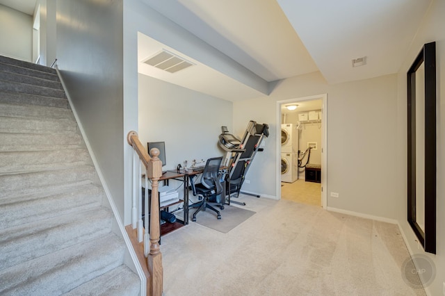 3460 Bradbury Cir, Aurora, IL 60504 - carpeted office space featuring stacked washer and clothes dryer and baseboards