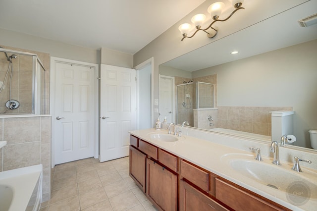 3460 Bradbury Cir, Aurora, IL 60504 - bathroom featuring tile patterned floors, a stall shower, a bath, and double vanity