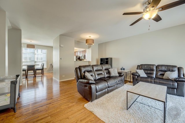 3460 Bradbury Cir, Aurora, IL 60504 - living area with ceiling fan, light wood-type flooring, and baseboards