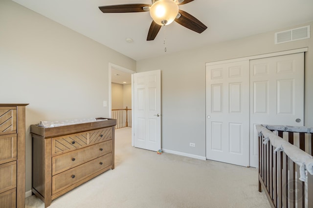 3460 Bradbury Cir, Aurora, IL 60504 - bedroom featuring light colored carpet, a closet, a ceiling fan, and baseboards