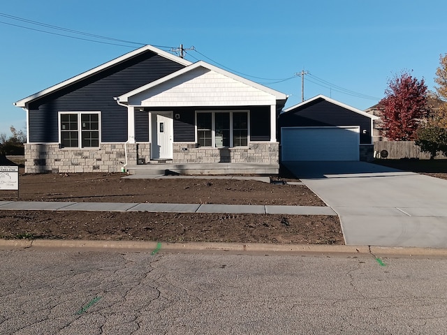 view of front facade with a garage and covered porch