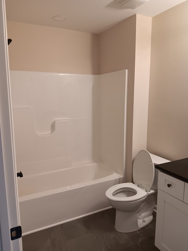 full bathroom with vanity, toilet, and  shower combination