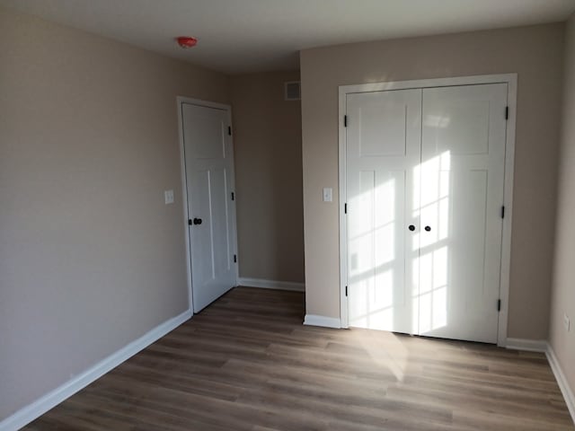 interior space with dark hardwood / wood-style floors