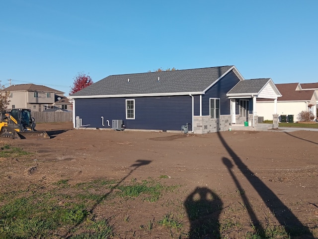 rear view of property with central air condition unit