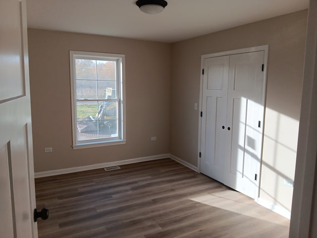 foyer entrance with wood-type flooring