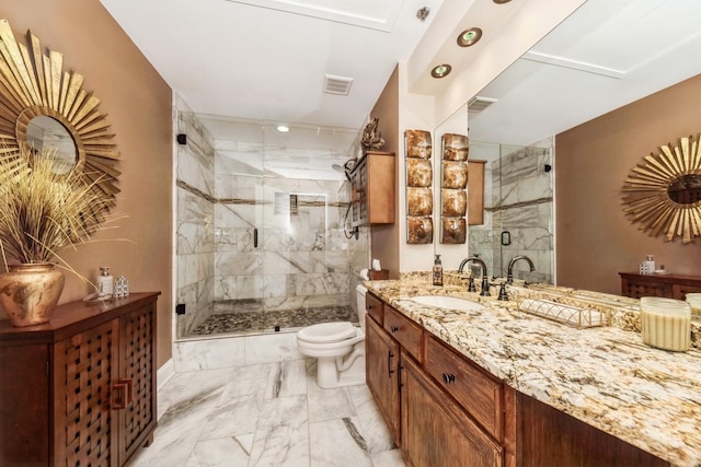 bathroom with vanity, toilet, and a shower with shower door