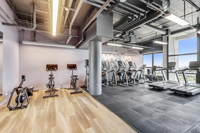 workout area with hardwood / wood-style floors