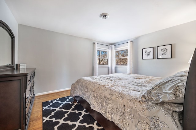 bedroom with light hardwood / wood-style flooring