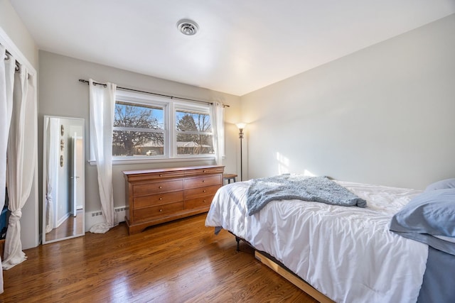 bedroom featuring dark hardwood / wood-style floors