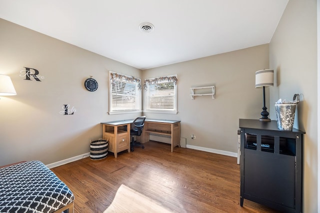 home office with wood-type flooring