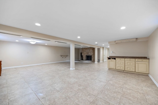 basement with a brick fireplace